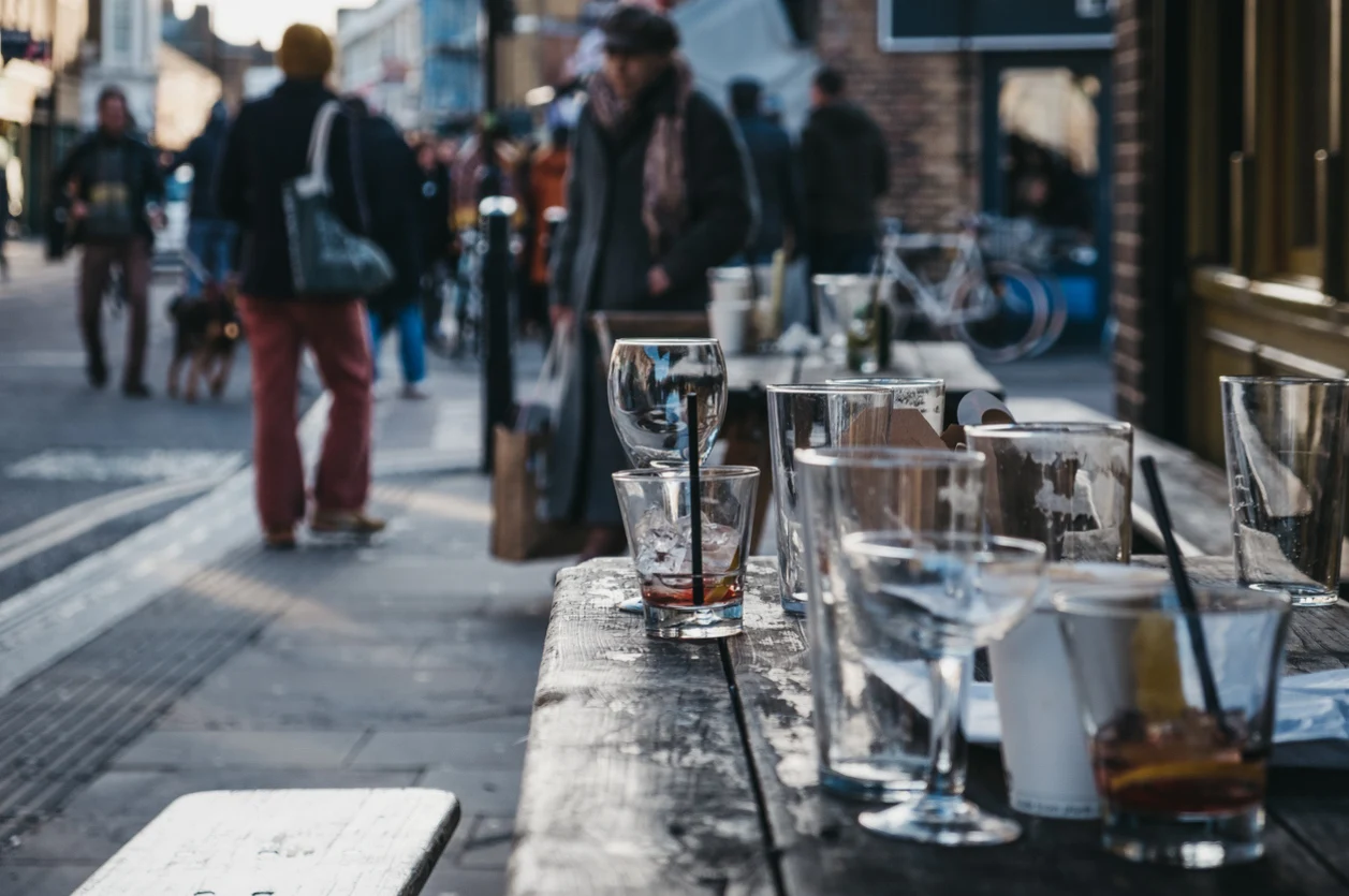 an image of a table of empty drinks in london after a session of weekend binge drinking